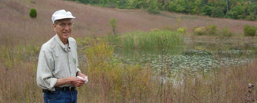 Bro. Don Geiger standing in the prairie that bears his name.